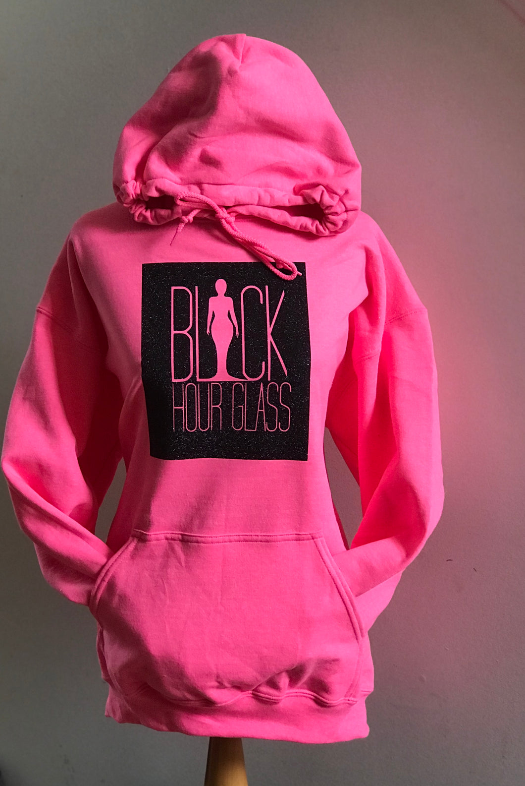 Neon Pink Hoodie with Inverted Silhouette Logo